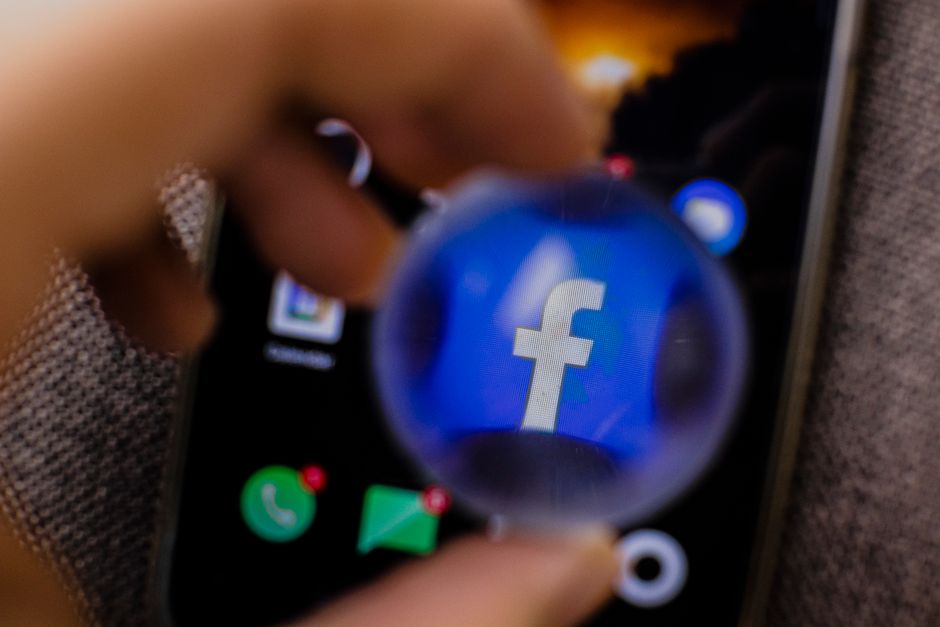 Close-up view of the Facebook app icon magnified on a smartphone screen.